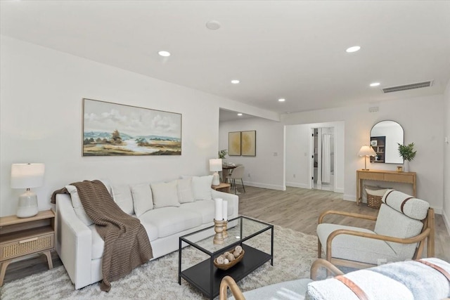 1015 4th St, Spencer, NC 28159 - living room featuring light wood-style flooring, recessed lighting, and baseboards