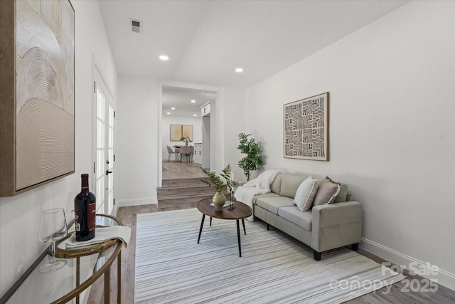 1015 4th St, Spencer, NC 28159 - living room featuring baseboards, wood finished floors, and recessed lighting