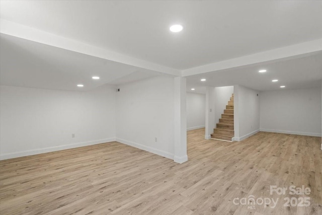 1015 4th St, Spencer, NC 28159 - finished basement featuring stairs, recessed lighting, light wood-style floors, and baseboards