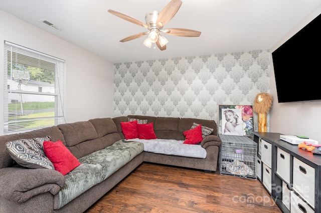 1016 W 10th Ave, Gastonia, NC 28052 - living area featuring wallpapered walls, wood finished floors, an accent wall, and a ceiling fan