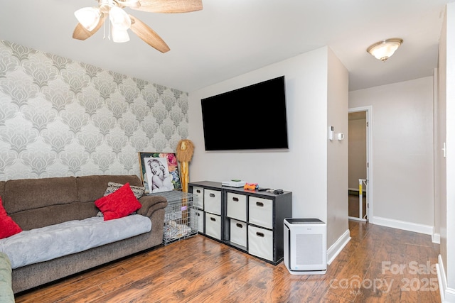 1016 W 10th Ave, Gastonia, NC 28052 - living area with wallpapered walls, an accent wall, a ceiling fan, wood finished floors, and baseboards