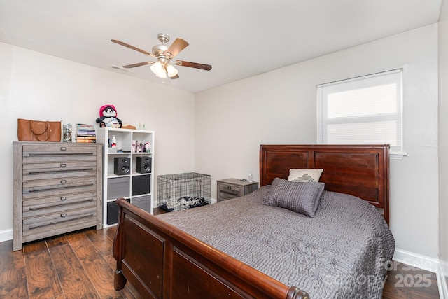 1016 W 10th Ave, Gastonia, NC 28052 - bedroom with dark wood-style flooring, baseboards, and a ceiling fan