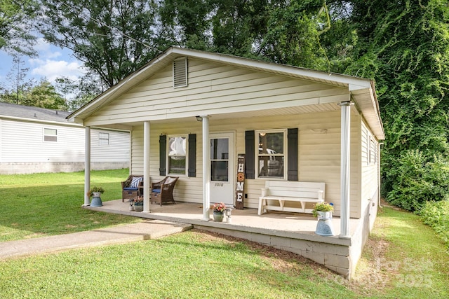1016 W 10th Ave, Gastonia, NC 28052 - view of front of property featuring a porch and a front yard
