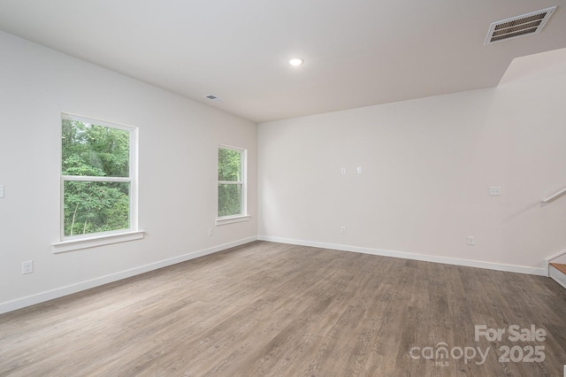 1941 32nd St NE, Hickory, NC 28601 - spare room with wood finished floors, baseboards, recessed lighting, and stairway
