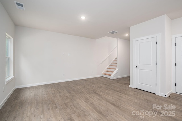 1941 32nd St NE, Hickory, NC 28601 - basement with wood finished floors, baseboards, stairway, and recessed lighting