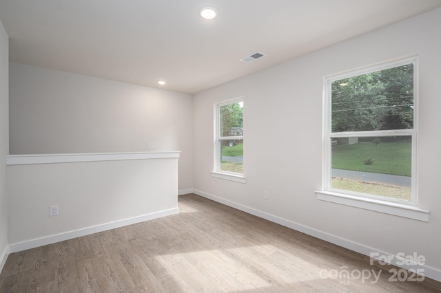 1941 32nd St NE, Hickory, NC 28601 - spare room with wood finished floors, baseboards, and recessed lighting