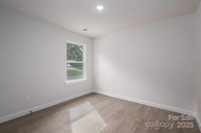 1941 32nd St NE, Hickory, NC 28601 - spare room with wood finished floors, baseboards, and recessed lighting