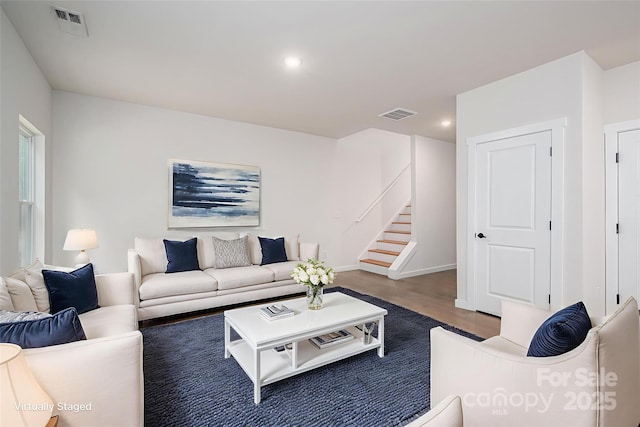 1941 32nd St NE, Hickory, NC 28601 - living room with wood finished floors, stairway, and recessed lighting