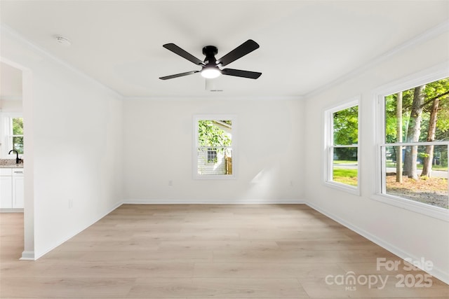 1155 Cedar Grove Ln, Rock Hill, SC 29732 - empty room with ornamental molding, plenty of natural light, light wood-style flooring, and a ceiling fan
