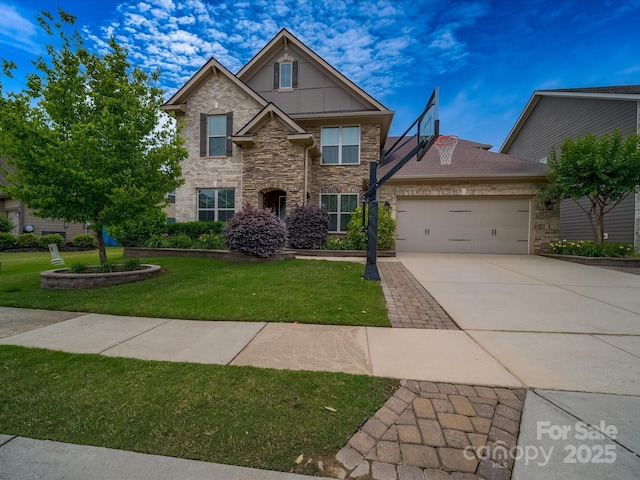 1190 Arges River Dr, Fort Mill, SC 29715 - traditional home featuring an attached garage, driveway, a front lawn, and stone siding