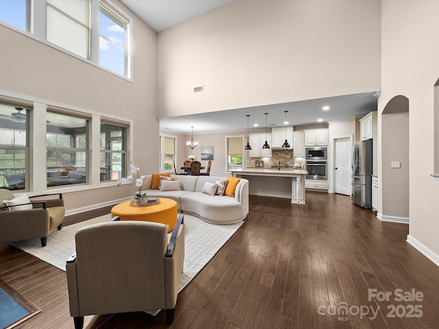 1190 Arges River Dr, Fort Mill, SC 29715 - living area featuring a high ceiling, dark wood-style flooring, and baseboards