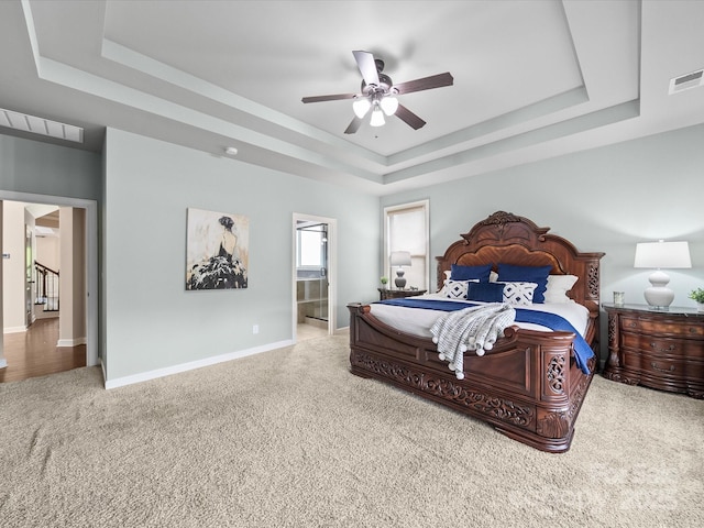 1190 Arges River Dr, Fort Mill, SC 29715 - bedroom with a raised ceiling, carpet, baseboards, ensuite bath, and ceiling fan