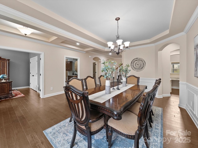 1190 Arges River Dr, Fort Mill, SC 29715 - dining area with arched walkways, a chandelier, dark wood finished floors, and ornamental molding