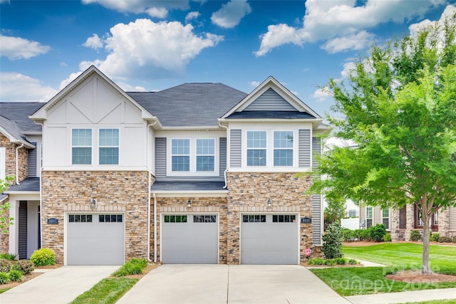 5836 Clan Maclaine Dr, Charlotte, NC 28278 - view of property featuring stone siding, concrete driveway, a garage, a shingled roof, and a front yard