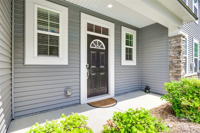 5836 Clan Maclaine Dr, Charlotte, NC 28278 - view of exterior entry with covered porch and stone siding