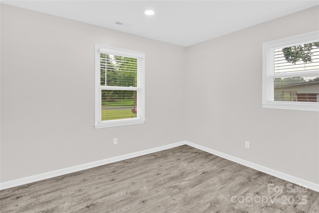 4108 Mellon Rd, Matthews, NC 28104 - unfurnished room featuring wood finished floors, healthy amount of natural light, baseboards, and recessed lighting