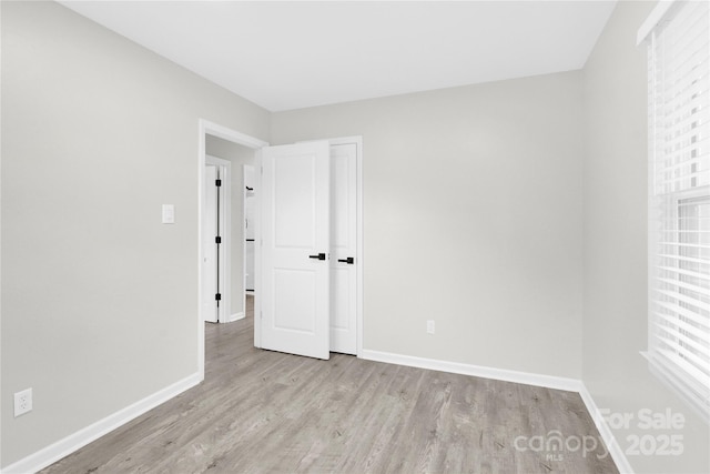 4108 Mellon Rd, Matthews, NC 28104 - unfurnished bedroom with wood finished floors and baseboards