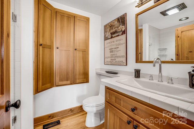 2399 El Miner Dr, Mars Hill, NC 28754 - full bathroom with vanity, wood finished floors, and a shower