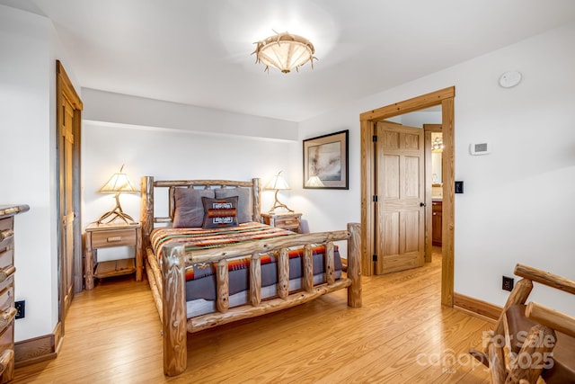 2399 El Miner Dr, Mars Hill, NC 28754 - bedroom featuring light wood-style flooring and baseboards