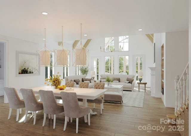 4995 Wildlife Ln Unit 1, Sherrills Ford, NC 28673 - dining space featuring light wood-type flooring, a high ceiling, recessed lighting, and a chandelier
