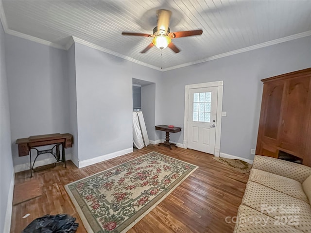 204 N Gaston St, Kings Mountain, NC 28086 - sitting room with wood finished floors, a ceiling fan, baseboards, and crown molding