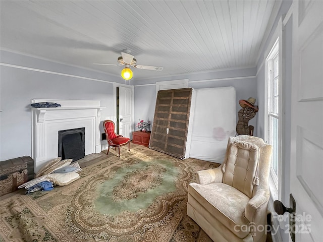 204 N Gaston St, Kings Mountain, NC 28086 - sitting room with a fireplace, ceiling fan, and crown molding