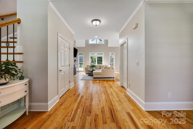 6409 Barkley Farm Rd, Huntersville, NC 28078 - hallway featuring light wood-style floors, stairway, crown molding, and baseboards
