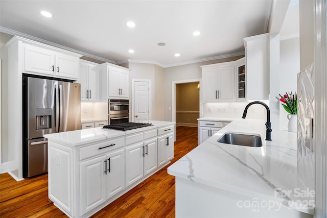 6409 Barkley Farm Rd, Huntersville, NC 28078 - kitchen featuring a sink, stainless steel appliances, crown molding, a kitchen island, and light stone countertops