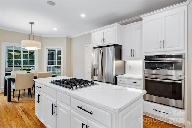 6409 Barkley Farm Rd, Huntersville, NC 28078 - kitchen with stainless steel appliances, light wood-style floors, hanging light fixtures, white cabinets, and recessed lighting
