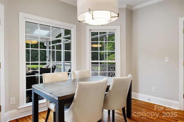 6409 Barkley Farm Rd, Huntersville, NC 28078 - dining room with crown molding, baseboards, and wood finished floors