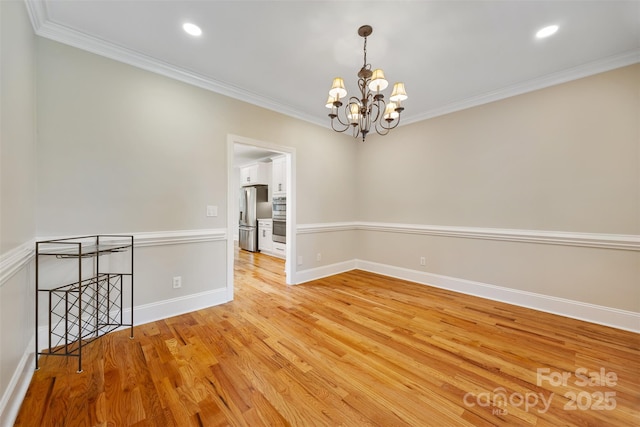 6409 Barkley Farm Rd, Huntersville, NC 28078 - unfurnished room featuring a chandelier, crown molding, light wood-type flooring, baseboards, and recessed lighting