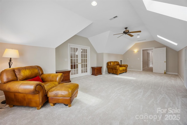 6409 Barkley Farm Rd, Huntersville, NC 28078 - living area with a skylight, light carpet, vaulted ceiling, baseboards, and a ceiling fan