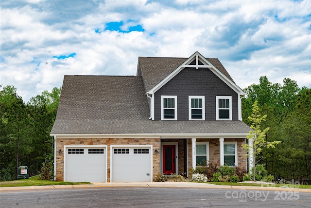 10100 Jack Nicklaus Dr, Lancaster, SC 29720 - craftsman-style house with roof with shingles, stone siding, and an attached garage