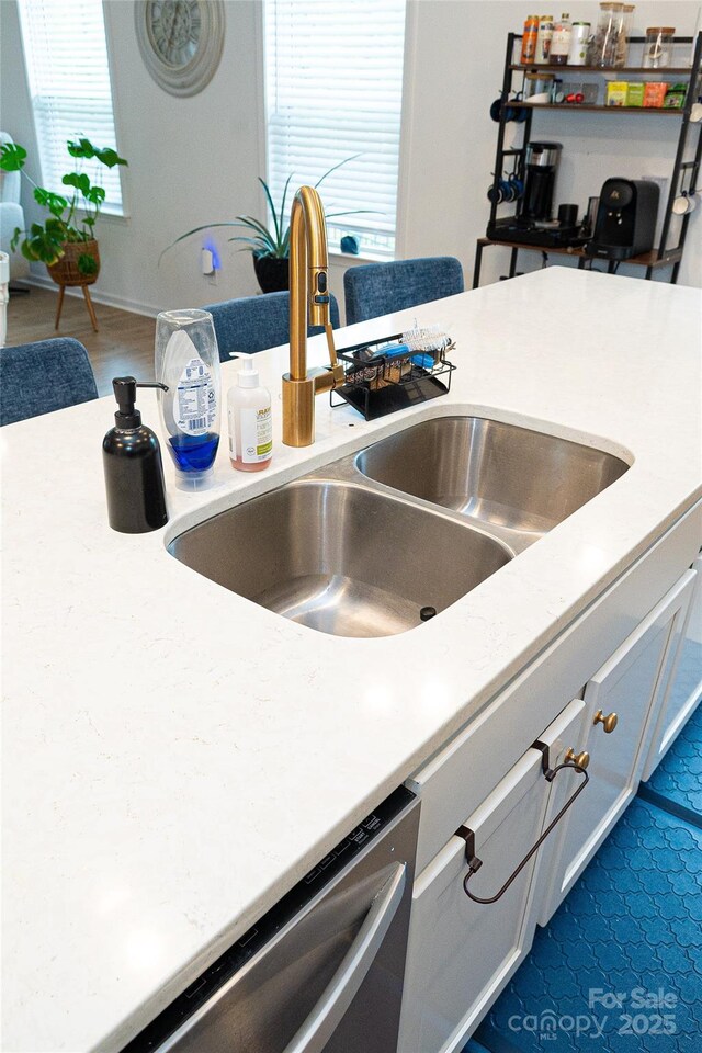10100 Jack Nicklaus Dr, Lancaster, SC 29720 - kitchen view of a sink, stainless steel dishwasher, and light countertops