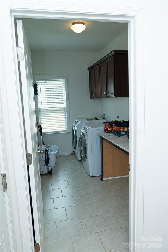 10100 Jack Nicklaus Dr, Lancaster, SC 29720 - laundry room with cabinet space, washer and dryer, and light tile patterned floors