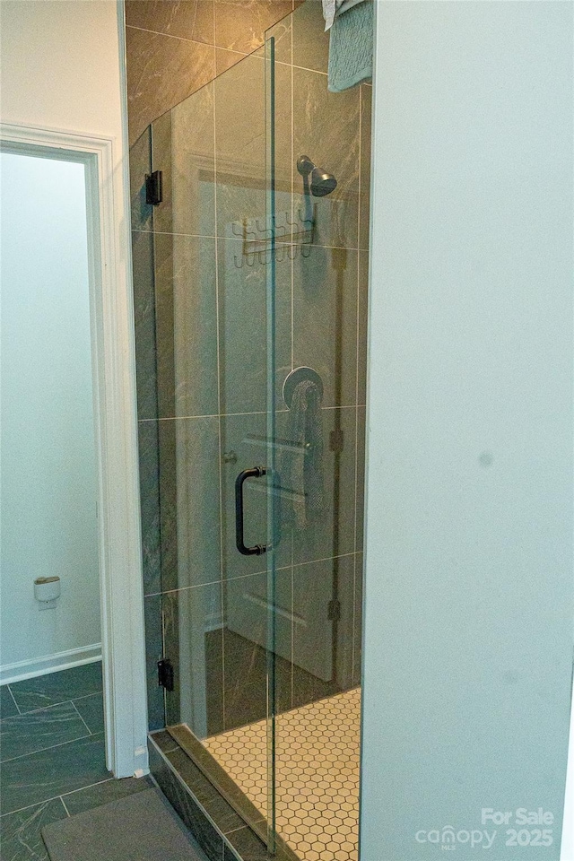 10100 Jack Nicklaus Dr, Lancaster, SC 29720 - bathroom with a shower stall and baseboards