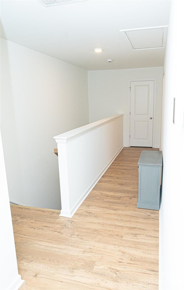 10100 Jack Nicklaus Dr, Lancaster, SC 29720 - corridor with an upstairs landing, light wood-type flooring, and attic access