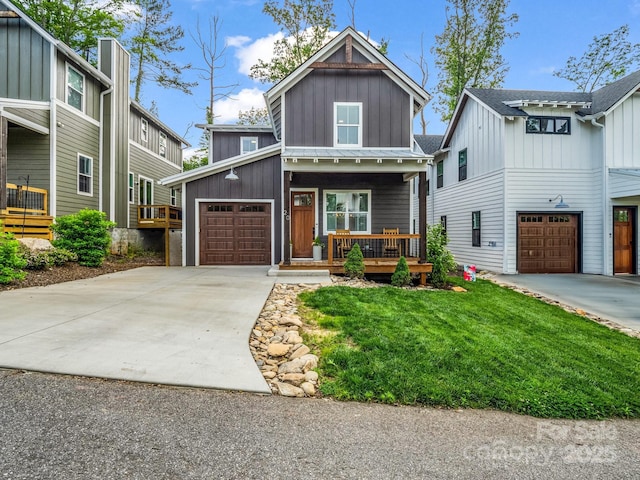 20 Phillip Ln, Arden, NC 28704 - view of front of property featuring board and batten siding, a porch, concrete driveway, and a front lawn