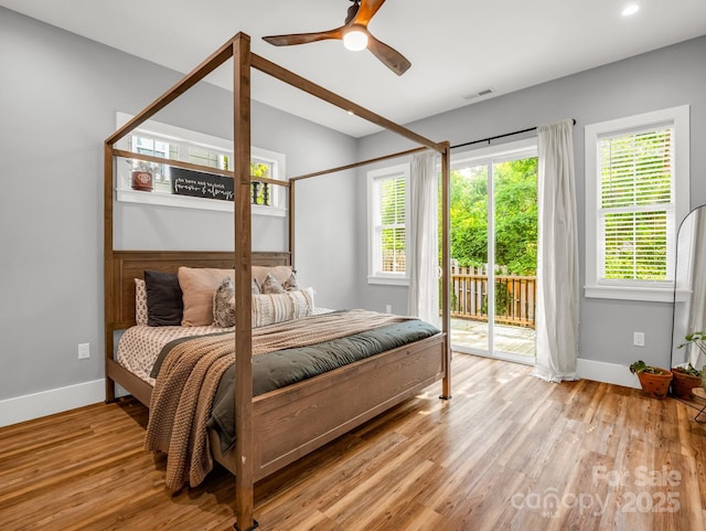 20 Phillip Ln, Arden, NC 28704 - bedroom with access to outside, baseboards, and wood finished floors