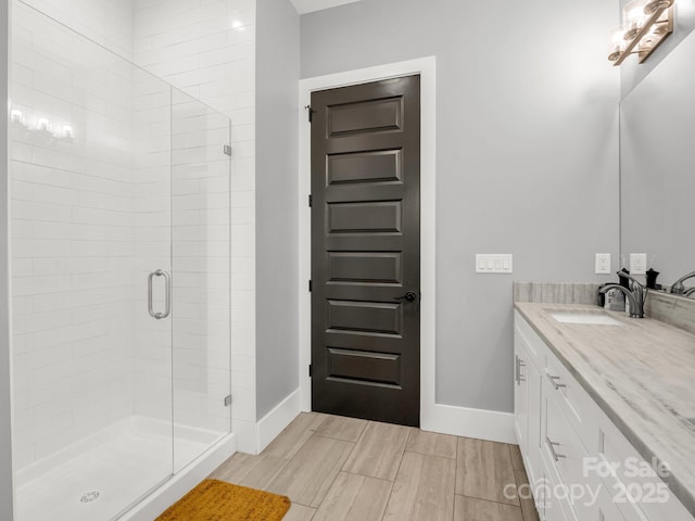 20 Phillip Ln, Arden, NC 28704 - bathroom with a shower stall, vanity, baseboards, and wood tiled floors