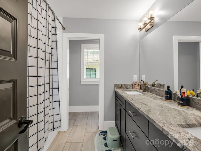 20 Phillip Ln, Arden, NC 28704 - full bathroom featuring a shower with curtain, double vanity, and baseboards