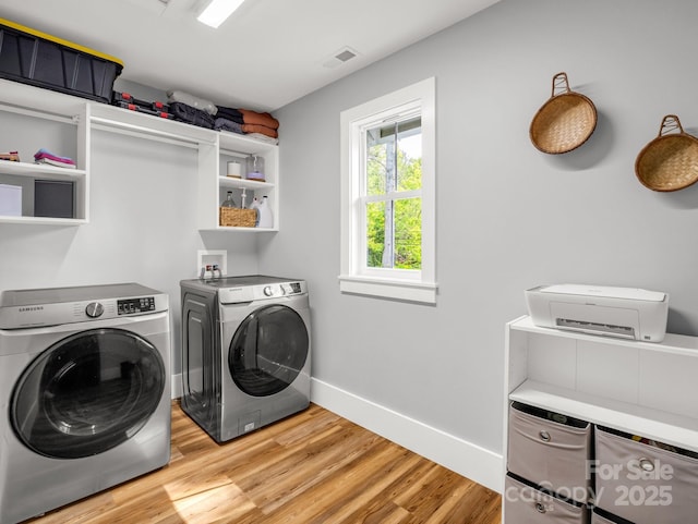 20 Phillip Ln, Arden, NC 28704 - washroom featuring washing machine and dryer, light wood finished floors, and baseboards
