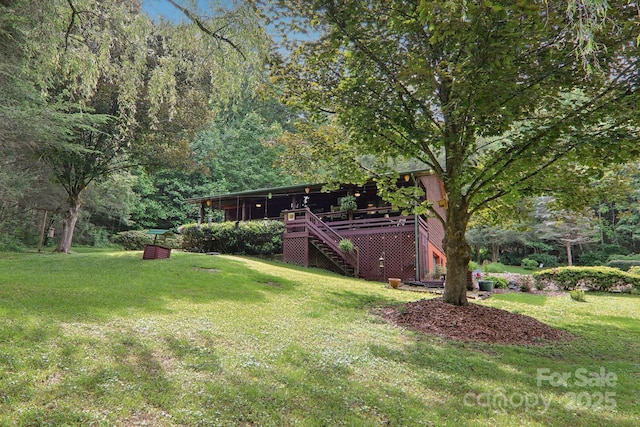 457 Shady Ridge Rd, Waynesville, NC 28785 - view of green lawn with stairway and a wooden deck