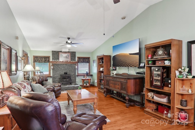 457 Shady Ridge Rd, Waynesville, NC 28785 - living area with ceiling fan, lofted ceiling, wood finished floors, and a wood stove