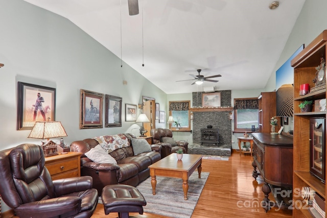457 Shady Ridge Rd, Waynesville, NC 28785 - living area with ceiling fan, a wood stove, light wood-style floors, and lofted ceiling