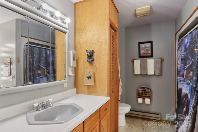 457 Shady Ridge Rd, Waynesville, NC 28785 - bathroom with a baseboard heating unit, vanity, toilet, and a shower with shower curtain