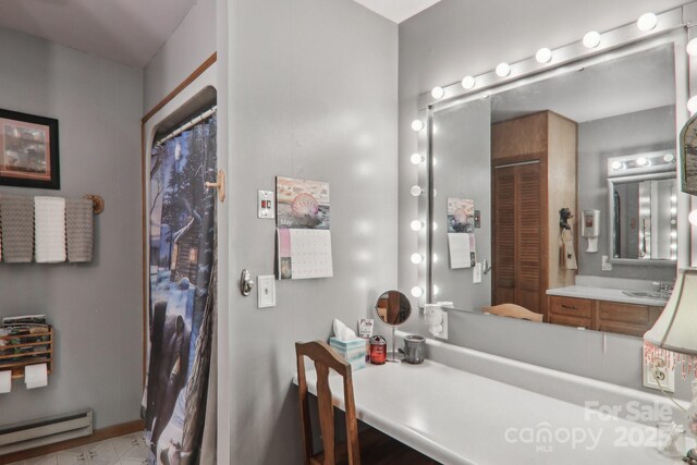 457 Shady Ridge Rd, Waynesville, NC 28785 - bathroom featuring baseboard heating and vanity