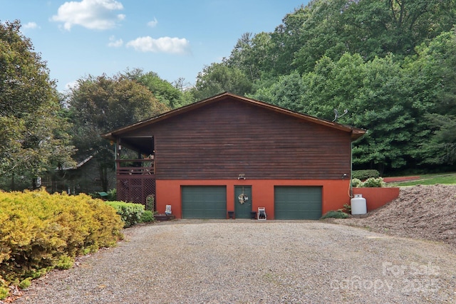 457 Shady Ridge Rd, Waynesville, NC 28785 - view of home's exterior with gravel driveway and an attached garage