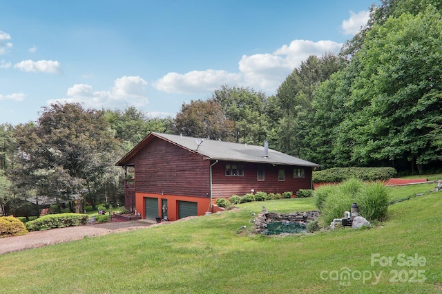 457 Shady Ridge Rd, Waynesville, NC 28785 - view of property exterior with driveway, an attached garage, and a yard