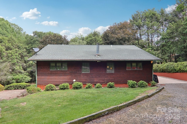 457 Shady Ridge Rd, Waynesville, NC 28785 - view of home's exterior featuring a lawn and roof with shingles
